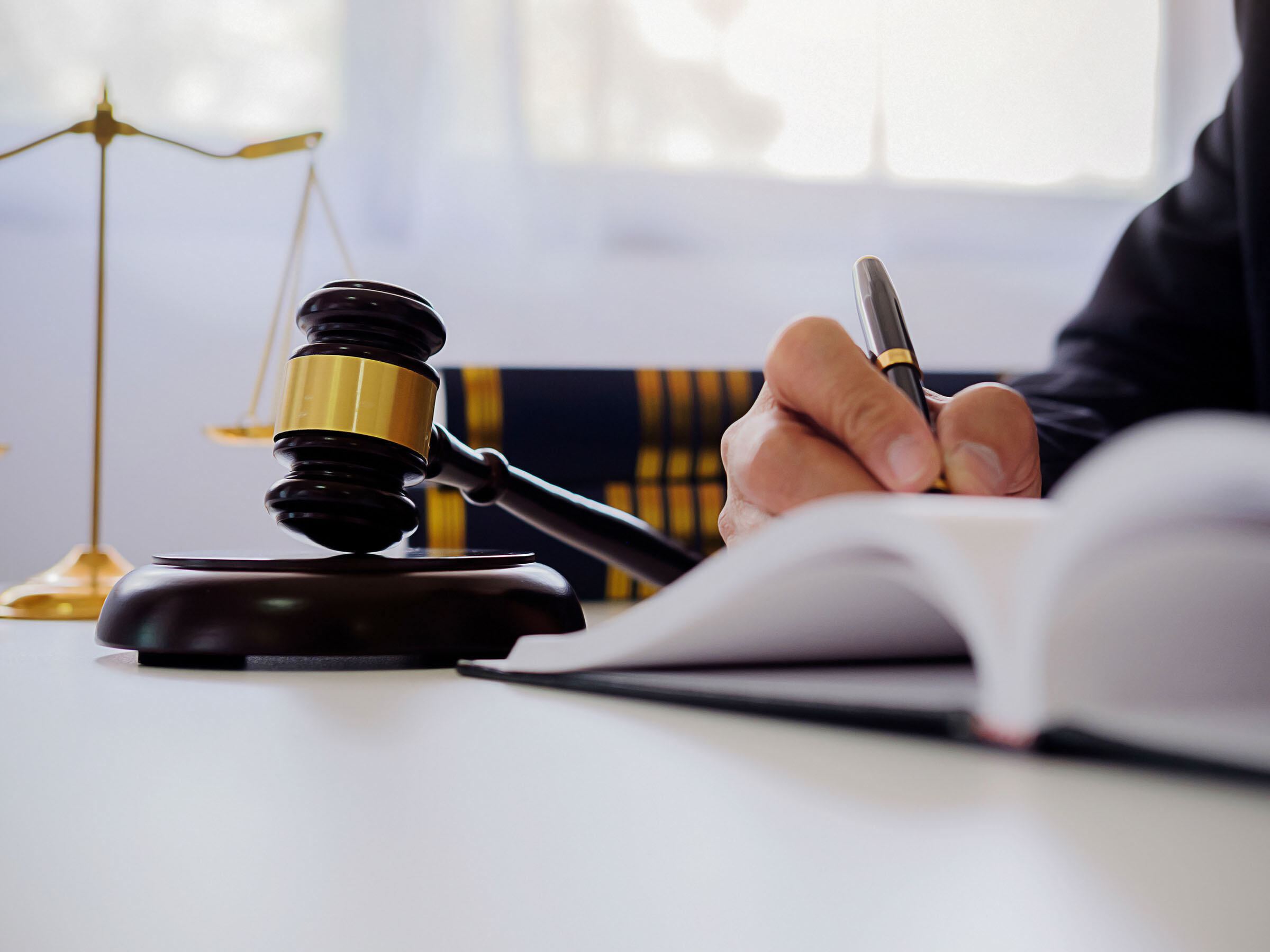 judge gavel with justice lawyers having team meeti HMWWXEN